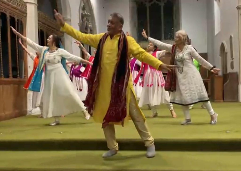 A group of people taking part in a Bollywood dance performance.