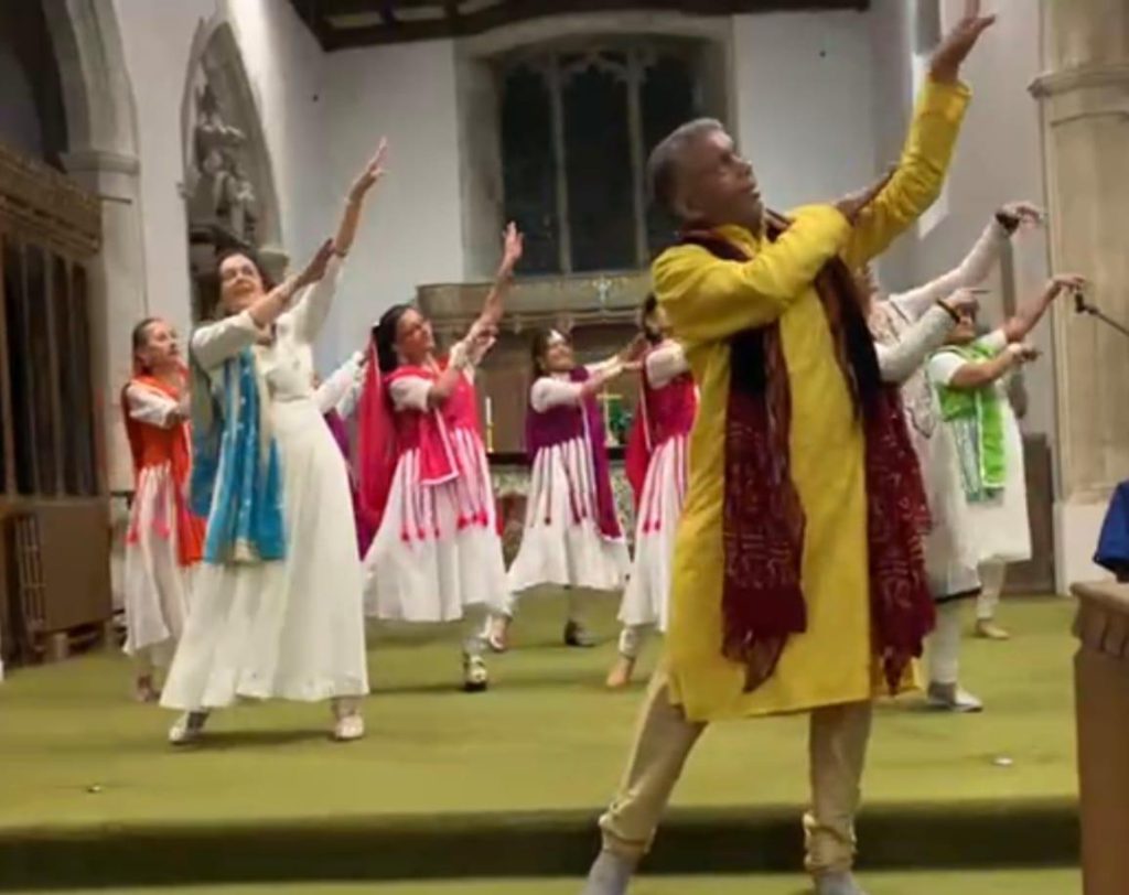 A group of people taking part in a Bollywood dance performance.